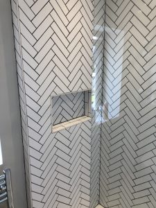 Shower room herringbone tiling